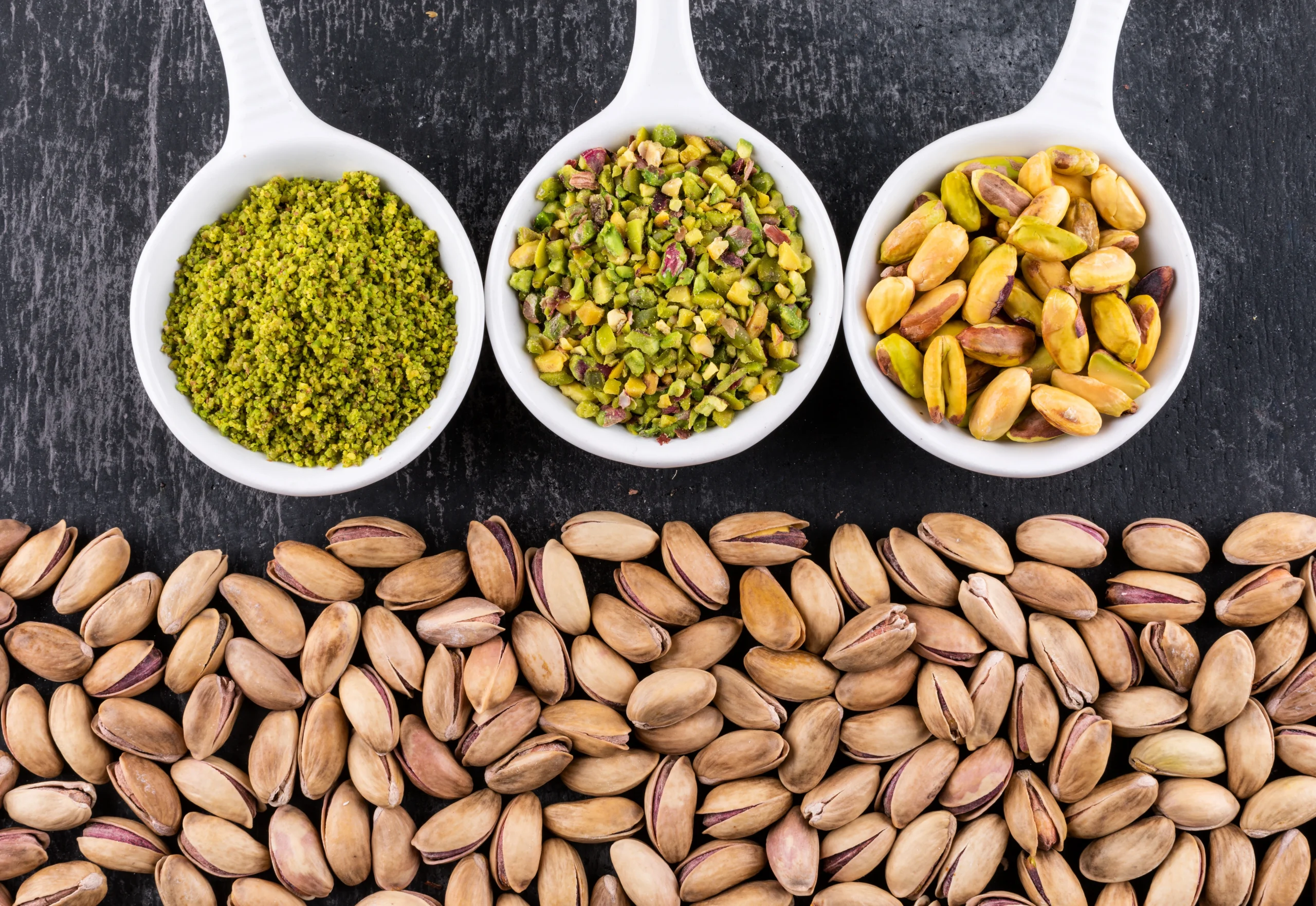 top-view-ground-milled-crushed-pistachios-bowl-gray-texture (1)